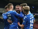 St Johnstone's Shaun Rooney celebrates scoring their first goal with teammates in February 2021