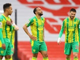 West Bromwich Albion's Matt Phillips and Okay Yokuslu look dejected after Arsenal's second goal on May 9, 2021