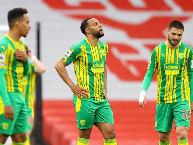 West Bromwich Albion's Matt Phillips and Okay Yokuslu look dejected after Arsenal's second goal on May 9, 2021