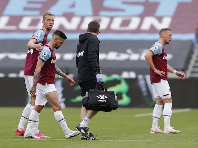 West Ham United's Manuel Lanzini receives medical attention after sustaining an injury on May 9, 2021