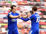Leicester City's Caglar Soyuncu celebrates scoring their second goal with James Maddison against Manchester United in the Premier League on May 11, 2021