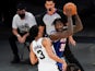 New York Knicks' Julius Randle protects the ball from San Antonio Spurs' Keldon Johnson on May 14, 2021