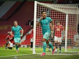 Liverpool's Roberto Firmino celebrates scoring against Manchester United in the Premier League on May 13, 2021
