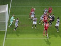 Liverpool goalkeeper Alisson Becker scores against West Bromwich Albion in the Premier League on May 16, 2021