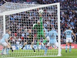 Ben Watson scores Wigan's first goal against Manchester City in the FA Cup final on May 11, 2013