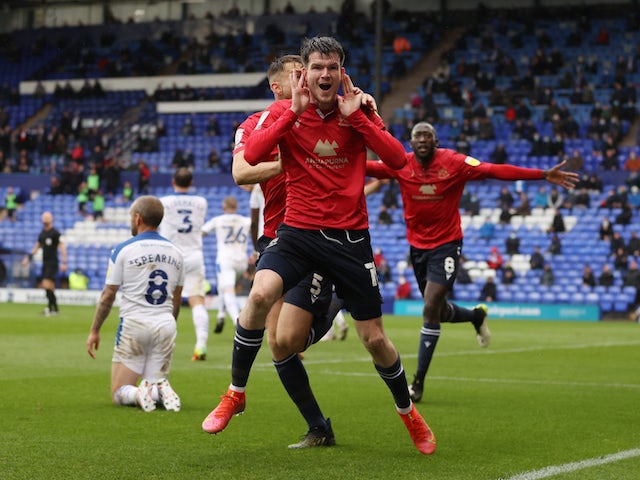 Morecambe's Liam McAlinden celebrates scoring against Tranmere Rovers on May 20, 2021