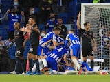 Brighton & Hove Albion's Dan Burn celebrates scoring their third goal against Manchester City in the Premier League on May 18, 2021
