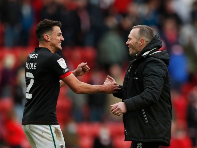 Lincoln City's manager Michael Appleton and Regan Poole celebrate after the match against Sunderland in the League One playoffs on May 22, 2021