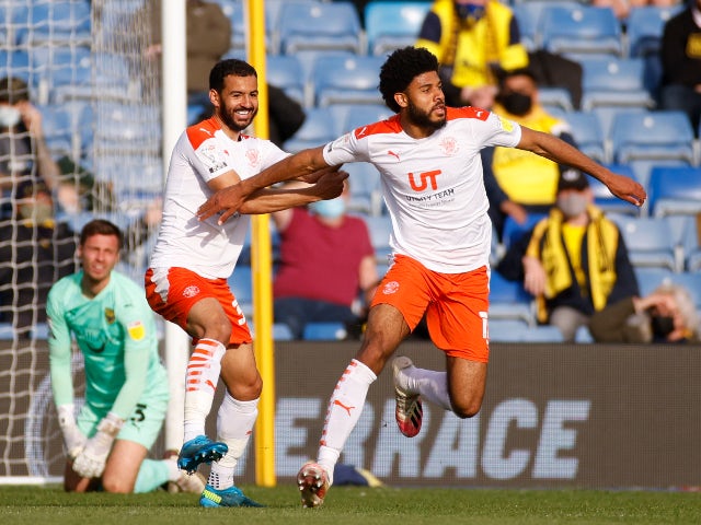 Blackpool's Ellis Sims celebrates after scoring his second goal against Oxford United in the League One play-offs on 18 May 2021
