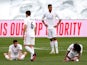 Real Madrid players look dejected after Atletico Madrid win the La Liga title on May 22, 2021