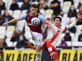 West Ham United's Declan Rice in action with Southampton's Takumi Minamino in the Premier League on May 23, 2021