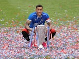 Rangers' James Tavernier poses with the trophy as he celebrates winning the Scottish Premiership on May 15, 2021