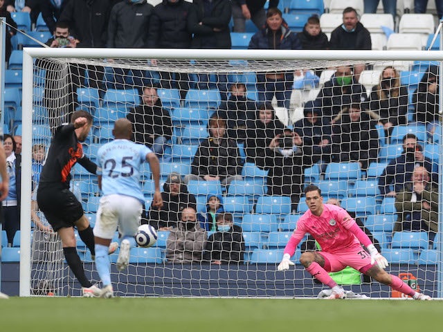 Manchester City's Ederson saves a penalty from Everton's Gylfi Sigurdsson on May 23, 2021