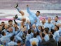 Manchester City's Sergio Aguero is thrown in the air by teammates as they celebrate winning the Premier League after his last match at the Etihad Stadium as a Manchester City player on May 23, 2021