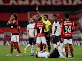 Flamengo's Willian Arao is shown a red card by referee Alexis Herrera on 20 May, 2021