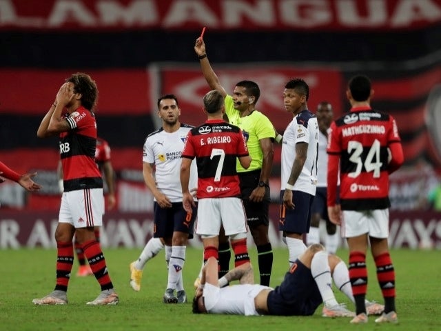 Flamengo's Willian Arao is shown a red card by referee Alexis Herrera on 20 May, 2021