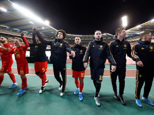 Belgium players celebrate in front of fans after qualifying for Euro 2020 in October 2019