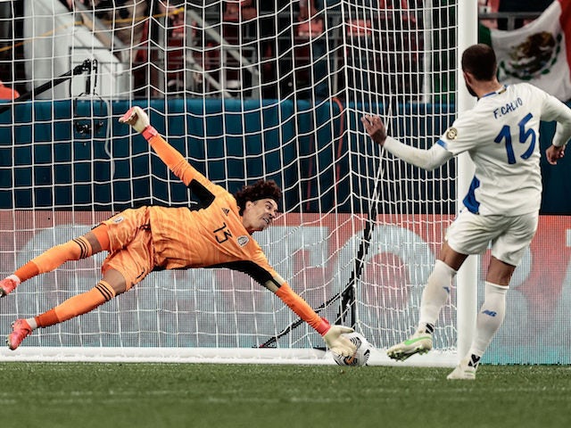 Mexico goalkeeper Guillermo Ochoa (13) is unable to make a save on a penalty kick from Costa Rica defender Francisco Calvo (15) during the semifinals of the 2021 CONCACAF Nations League soccer series at Empower Field at Mile High on June 4, 2021