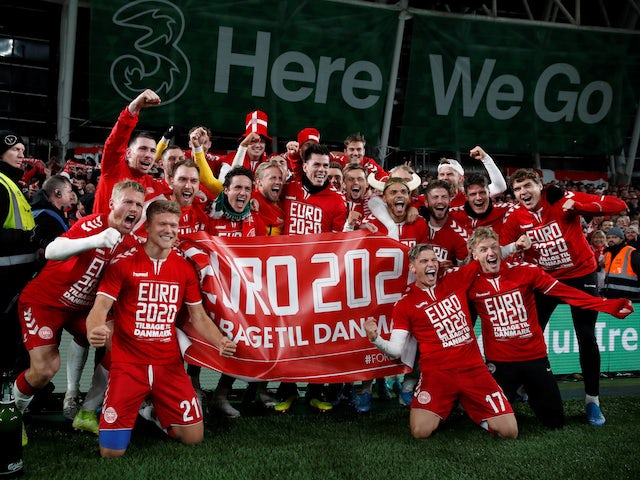 Denmark players pose for a photograph as the celebrate in front of their fans after the match in November 2019