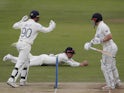 England's Rory Burns takes a catch to dismiss New Zealand's Henry Nicholls on June 6, 2021