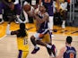 Phoenix Suns guard Cameron Payne is defended by Los Angeles Lakers forward Markieff Morris on June 4, 2021