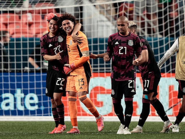 Mexico goalkeeper Guillermo Ochoa (13) celebrates with forward Hirving Lozano (22) and defender Luis Rodriguez (21) and forward Alan Pulido (11) after defeating Costa Rica on penalty kicks during the semifinals of the 2021 CONCACAF Nations League soccer s