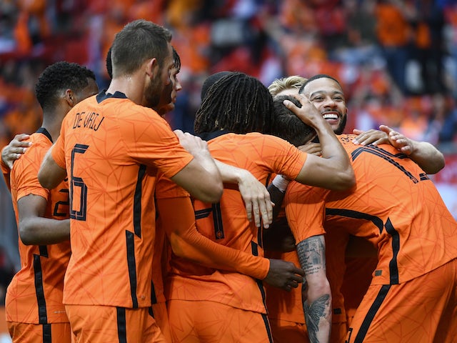 Netherlands' Wout Weghorst celebrates scoring their second goal with teammates on June 6, 2021