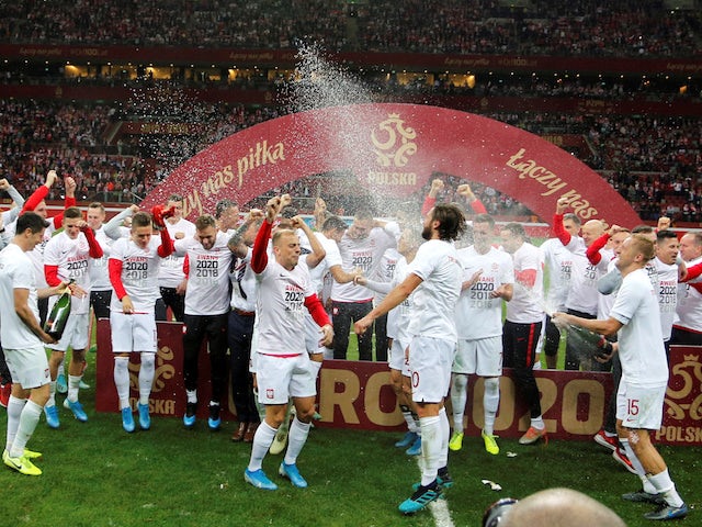 Poland players celebrate qualifying for Euro 2020 in October 2019