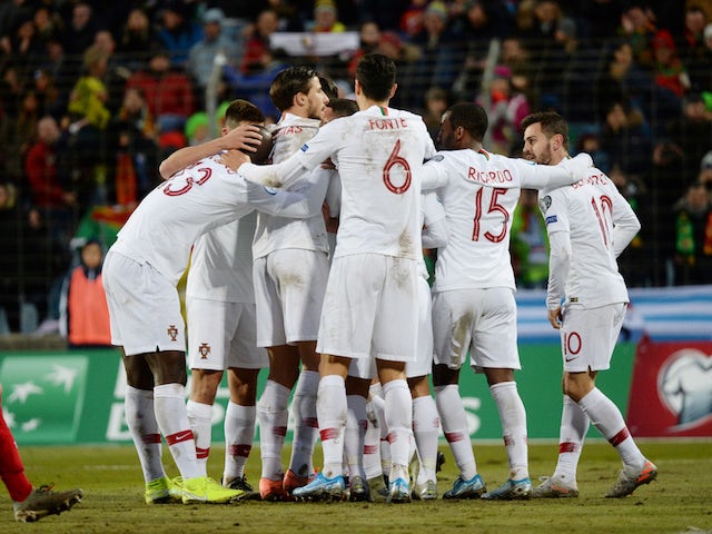 Portugal players celebrate scoring in the match that secured their place at Euro 2020, in November 2019