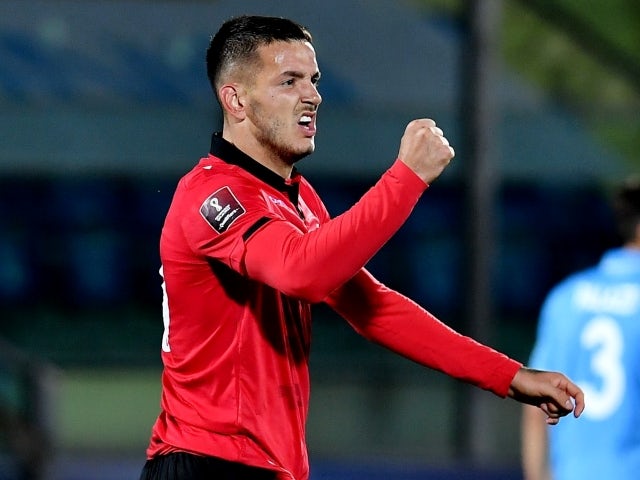 Albania's Rey Manaj celebrates scoring on March 31
