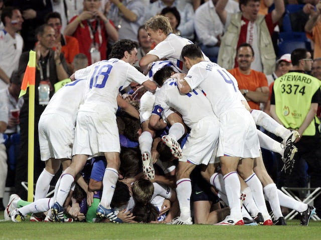 Russia players celebrate scoring against Netherlands at Euro 2008