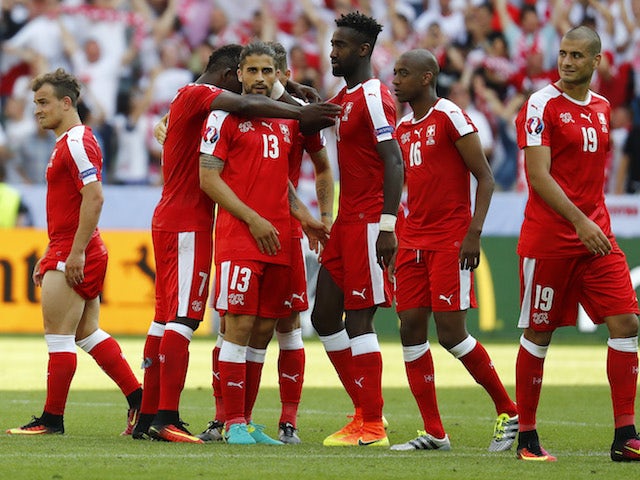Switzerland players react after losing a penalty shootout to Poland at Euro 2016 on June 25, 2016