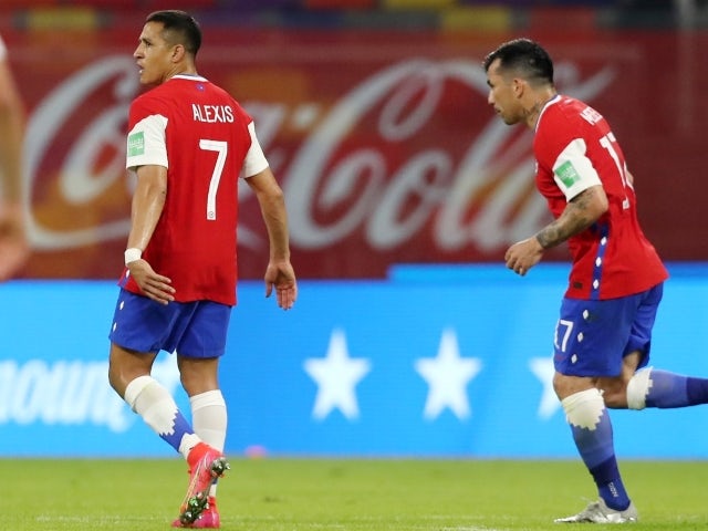 Chile's Alexis Sanchez celebrates scoring their first goal with Gary Medel on June 4, 2021