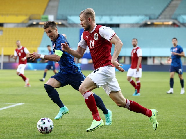 Austria's Konrad Laimer in action with Slovakia's Peter Pekarik on June 6, 2021