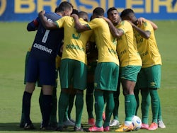 Cuiaba players huddle before the match on June 6, 2021