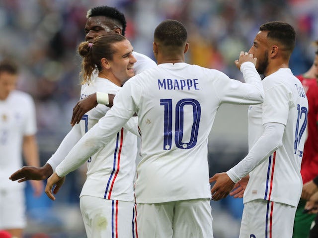 France's Antoine Griezmann celebrates scoring their first goal with teammates on June 8, 2021