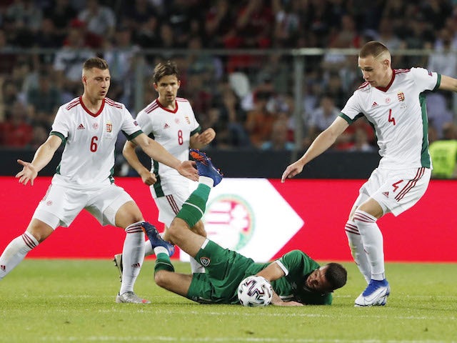 Hungary's Willi Orban and Attila Szalai in action with Republic of Ireland Troy Parrott on June 8, 2021