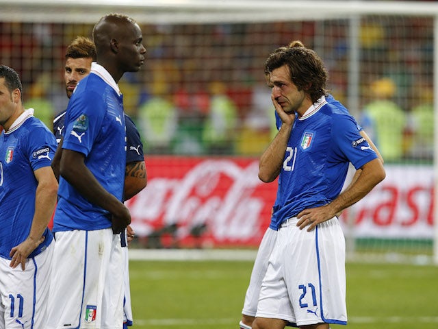 Italy players are dejected after losing in the final of Euro 2012
