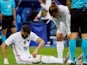 France's Karim Benzema down injured as Antoine Griezmann looks on, on June 8, 2021