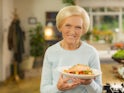 Mary Berry poses with a salmon fillet