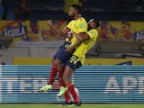 Colombia's Miguel Borja celebrates scoring their second goal with teammate Yerry Mina on June 9, 2021