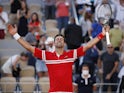 Novak Djokovic celebrates winning the 2021 French Open on June 13, 2021
