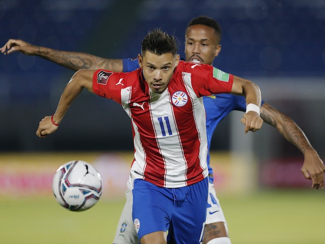 Paraguay's Angel Romero in action with Brazil's Eder Militao on June 9, 2021