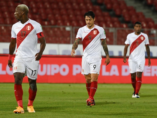Peru's Gianluca Lapadula and teammates look dejected after the match on November 14, 2020