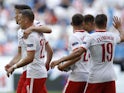 Poland players celebrate scoring against Iceland on June 8, 2021