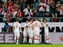 Poland's Jakub Swierczok celebrates scoring their first goal with teammates on June 1, 2021