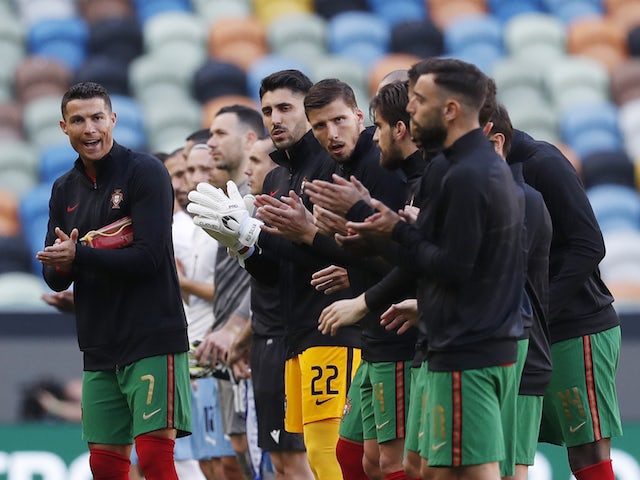 Portugal's Cristiano Ronaldo with teammates as they line up before the match on June 9, 2021
