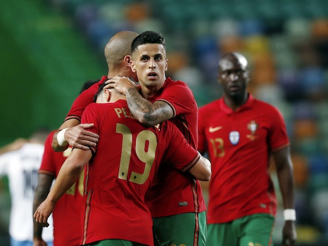 Portugal's Joao Cancelo celebrates scoring against Israel on June 9, 2021