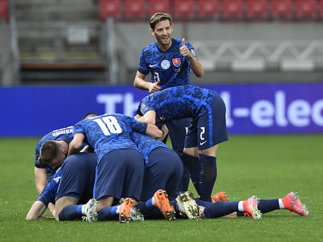 Slovakia's Robert Mak celebrates scoring their second goal with teammates on March 30, 2021