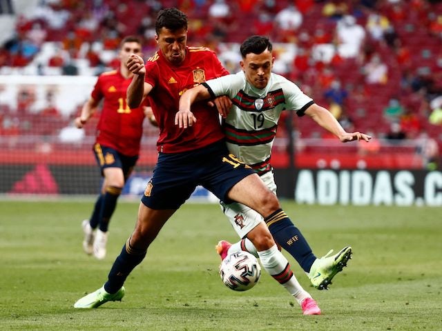 Portugal's Pedro Goncalves in action with Spain's Rodri on June 4, 2021
